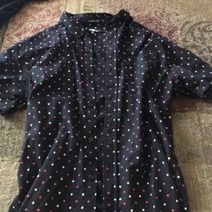 A pair of men’s short sleeve button down tee